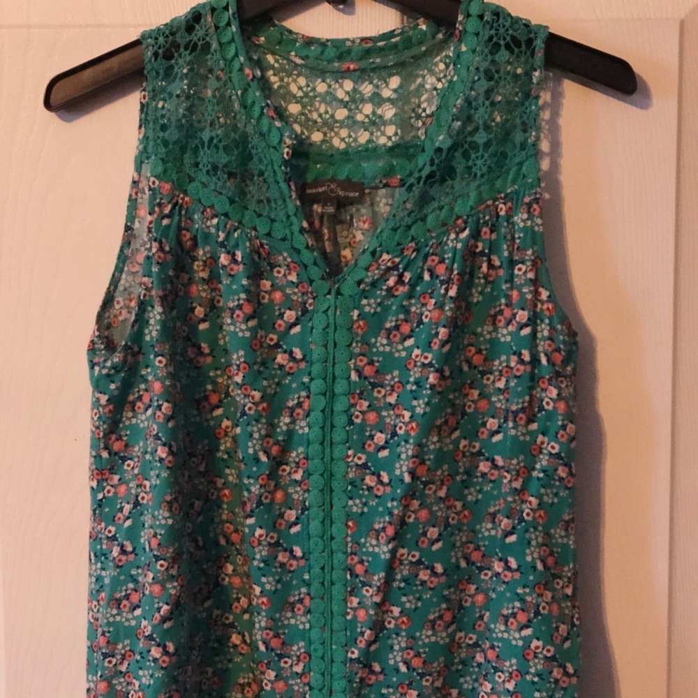 Multi colored tank top with lace accents.